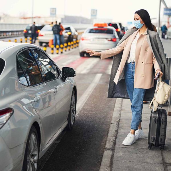 v2-stylish-woman-in-medical-mask-taking-cab-at-airpor-2021-09-04-14-23-49-utc v2-stylish-woman-in-medical-mask-taking-cab-at-airpor-2021-09-04-14-23-49-utc