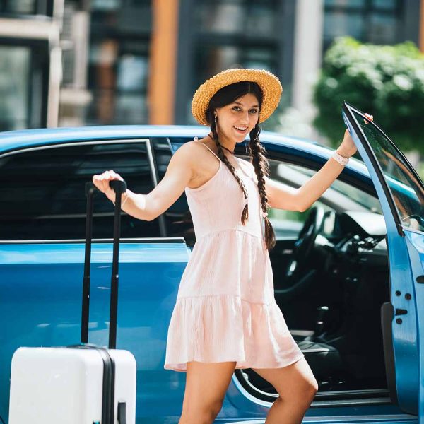v2-woman-traveling-with-suitcase-near-the-rental-car-2022-12-07-05-05-39-utc v2-woman-traveling-with-suitcase-near-the-rental-car-2022-12-07-05-05-39-utc